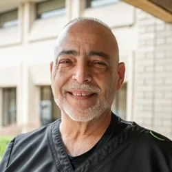 Dr Demetri smiling
